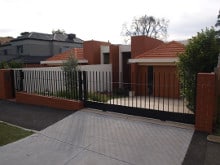 slat fences steel with automatic gate fawkner
