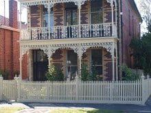 picket fences cream for double story home in melbourne suburb of fawkner