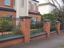tubular fence inlay with brick in strathmore